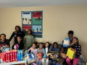 Children receiving snacks at our community snack program